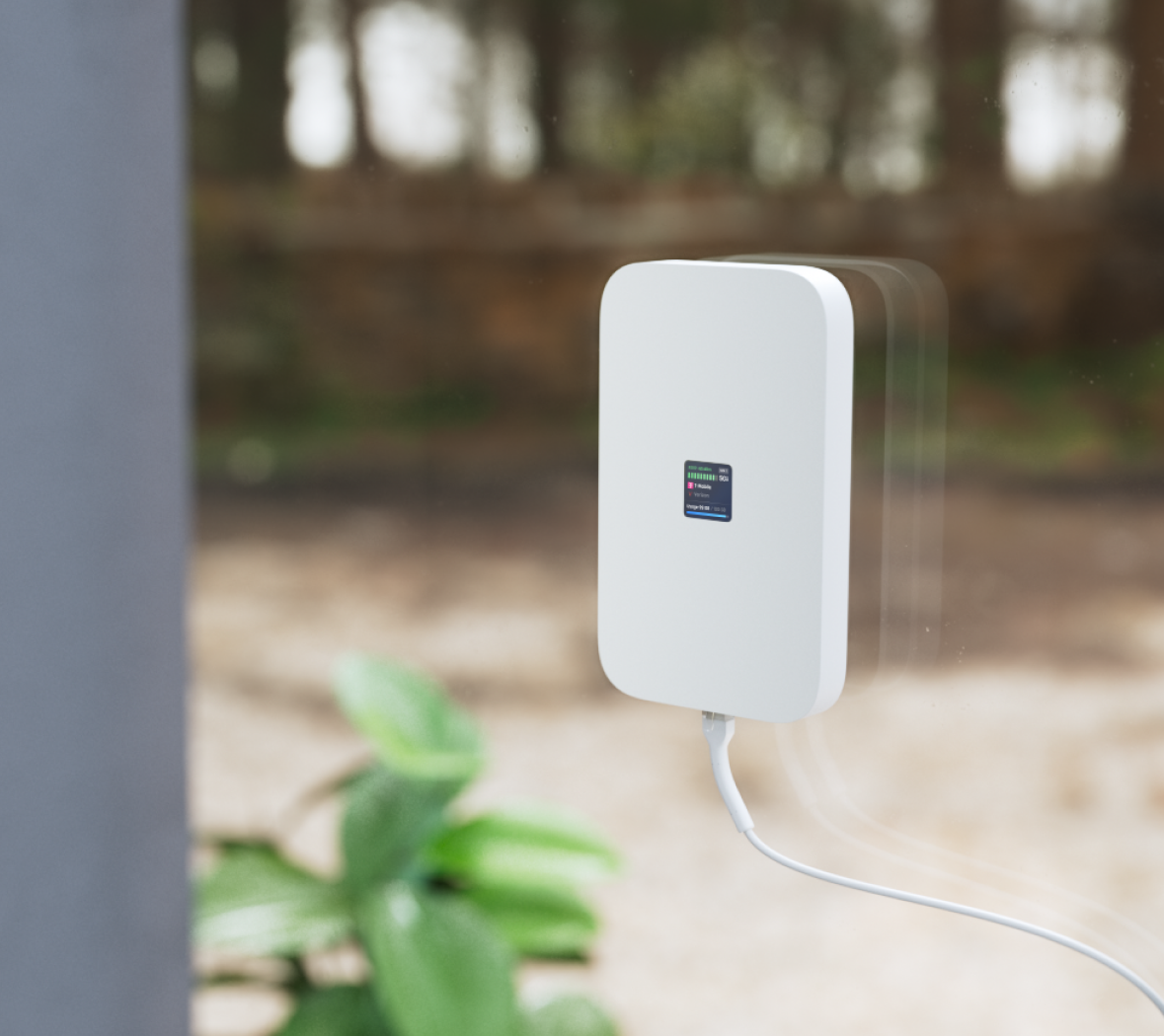 UniFi 5G Max bevestigd aan de binnenzijde van een raam